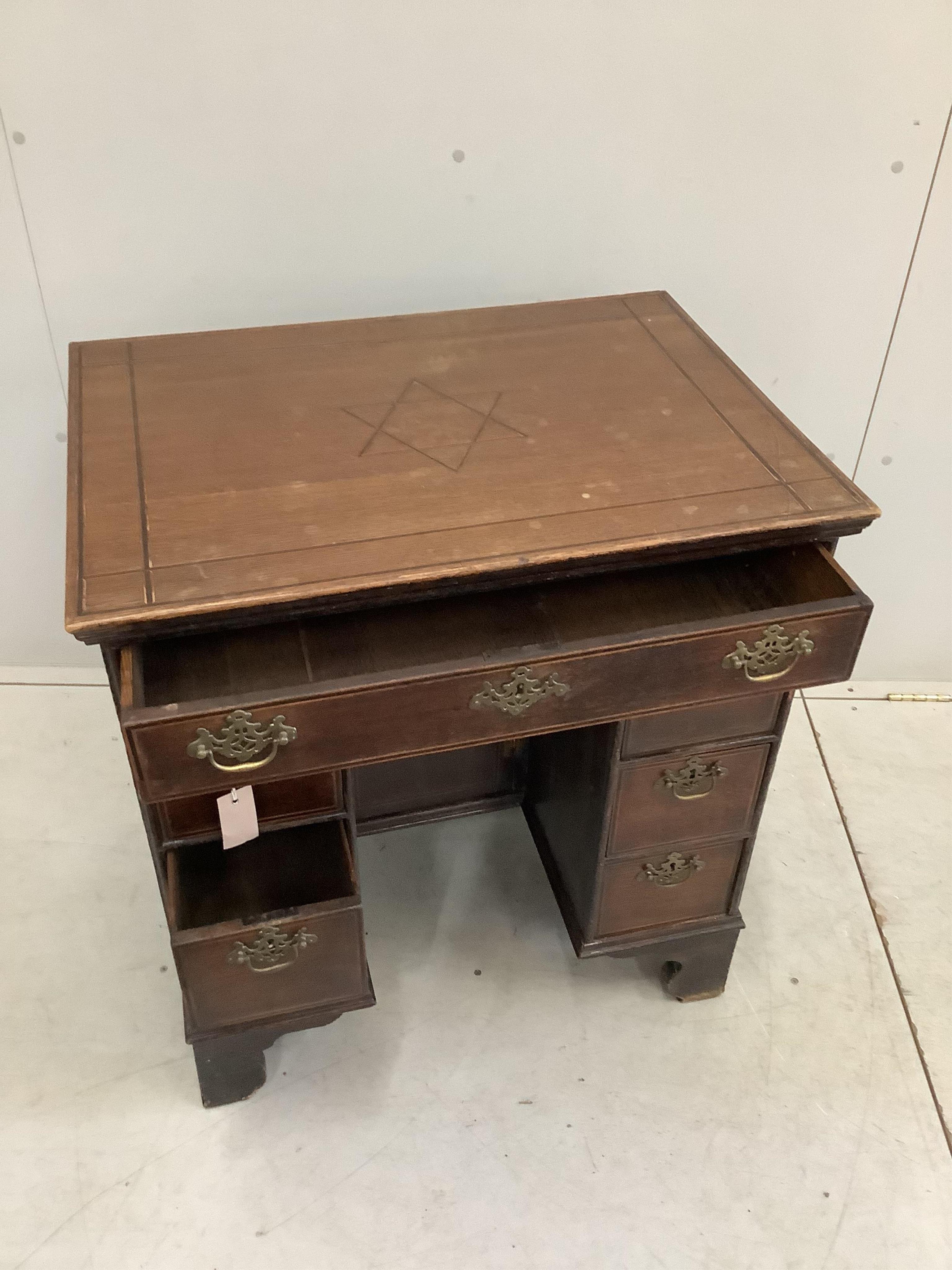 A 19th century banded oak kneehole desk, width 73cm, depth 53cm, height 80cm. Condition - fair